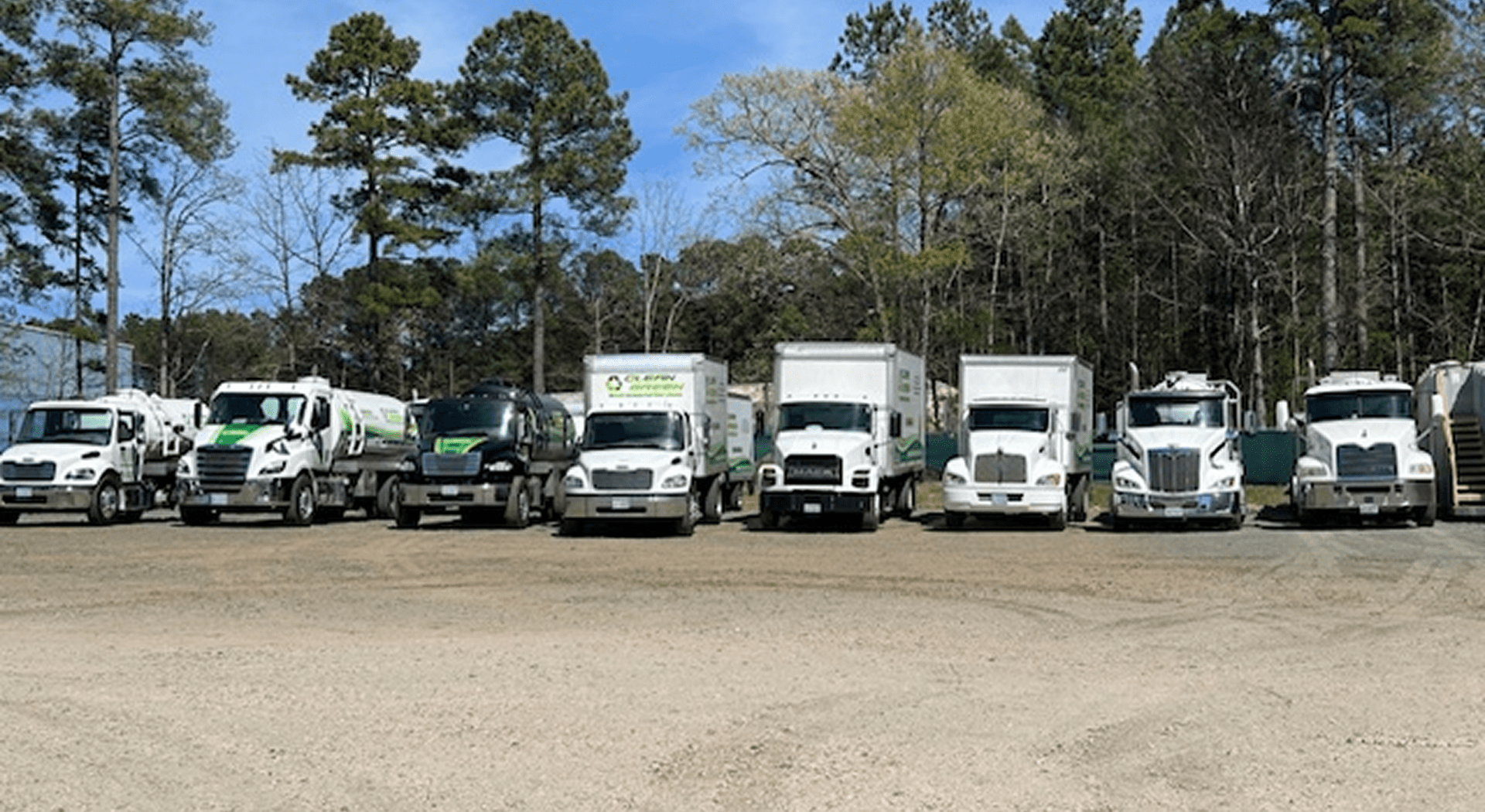 Fleet of trucks in outdoor setting.